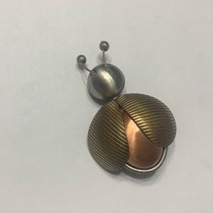 Ladybug pin with different tones of metal